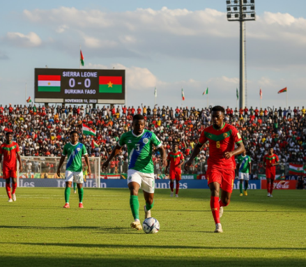 Sierra Leone vs Burkina Faso football match preview graphic with team logos and stadium background.